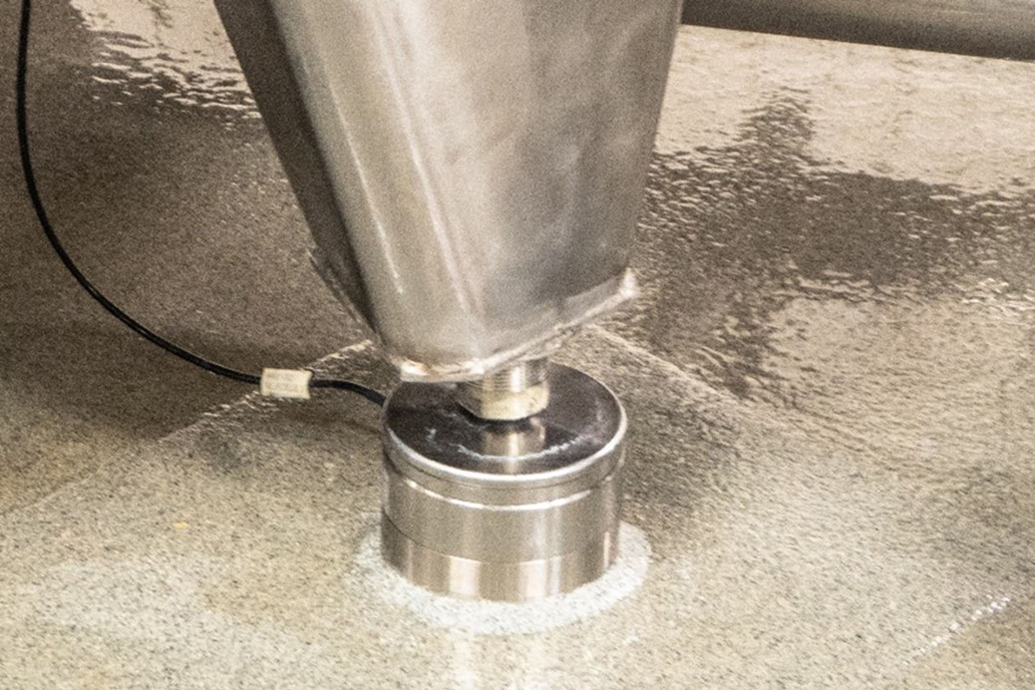 Capacitive digital load cell from Eilersen Electric A/S mounted under support for tank.